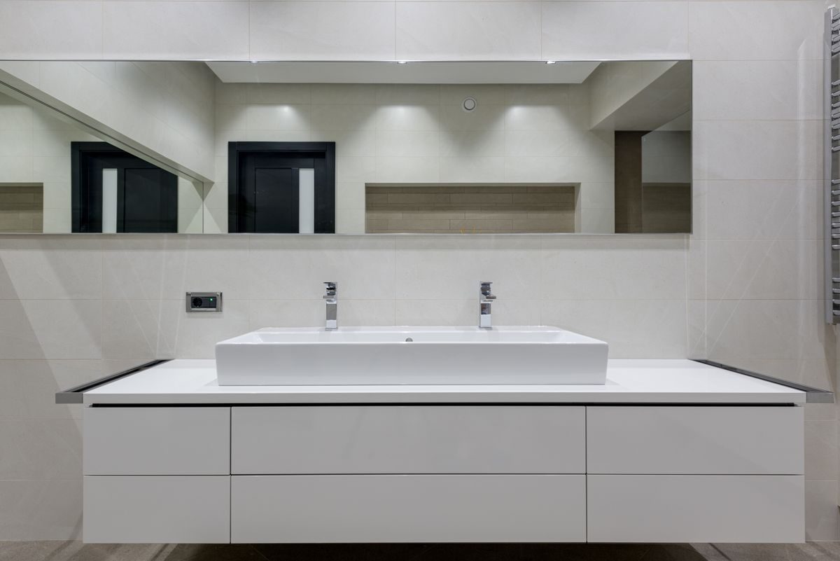 Renovated bathroom with double vessel sinks