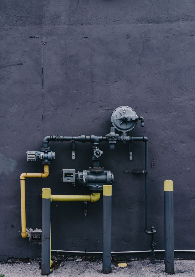 Gas meter and supply pipes on a wall